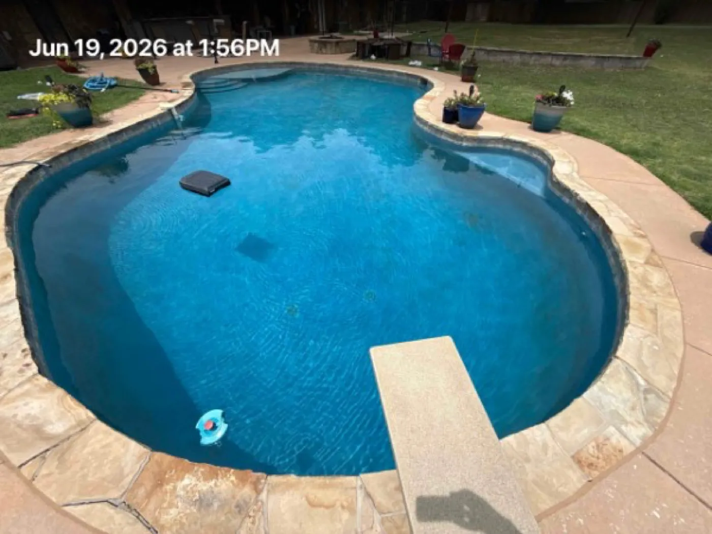 Sparkling clean backyard pool after professional cleaning in Oklahoma City